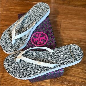 Tory Burch Monogram Flip Flops in Black and Cream